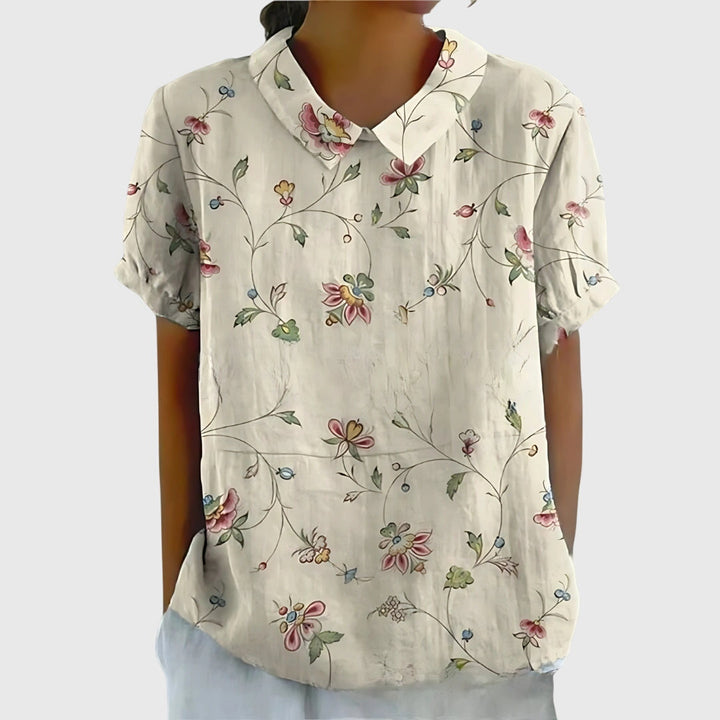 Jenna floral blouse by Isabel y Miguel Madrid, lightweight fabric with colorful floral print, long sleeves and V-neck design.