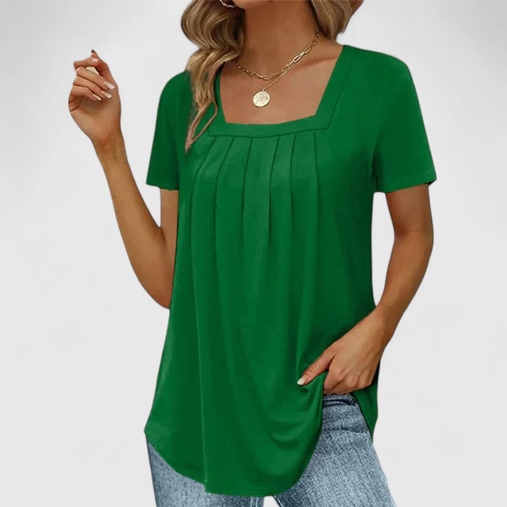 Lenabria Isabel y Miguel Madrid women's summer shirt, elegant lightweight blouse with floral patterns and short sleeves.