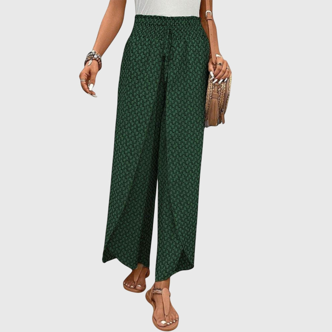Pantalones palazzo elegantes Chiara de Isabel y Miguel Madrid, con tela fluida y diseño moderno en color oscuro.