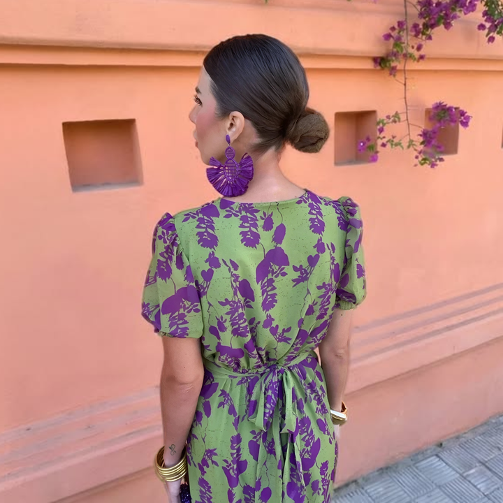 Andrea™ spring dress by Isabel y Miguel Madrid, featuring a floral design and lightweight fabric for warm weather.