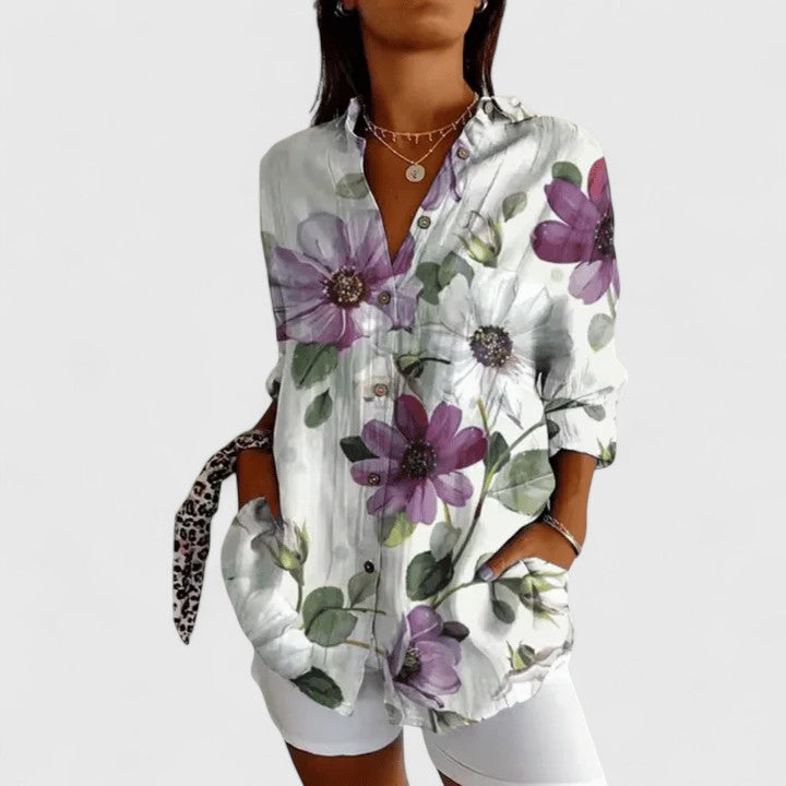 Isabel y Miguel Madrid Katarine floral blouse with elegant design, featuring colorful floral patterns and a stylish fit.
