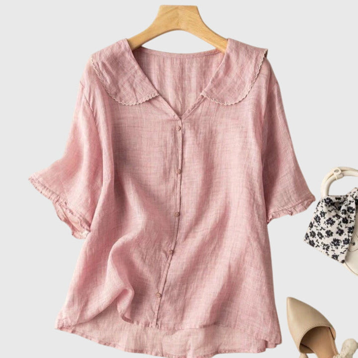 Elegant Adele™ blouse by Isabel y Miguel Madrid, featuring a stylish design and flowing fabric, displayed on a mannequin.