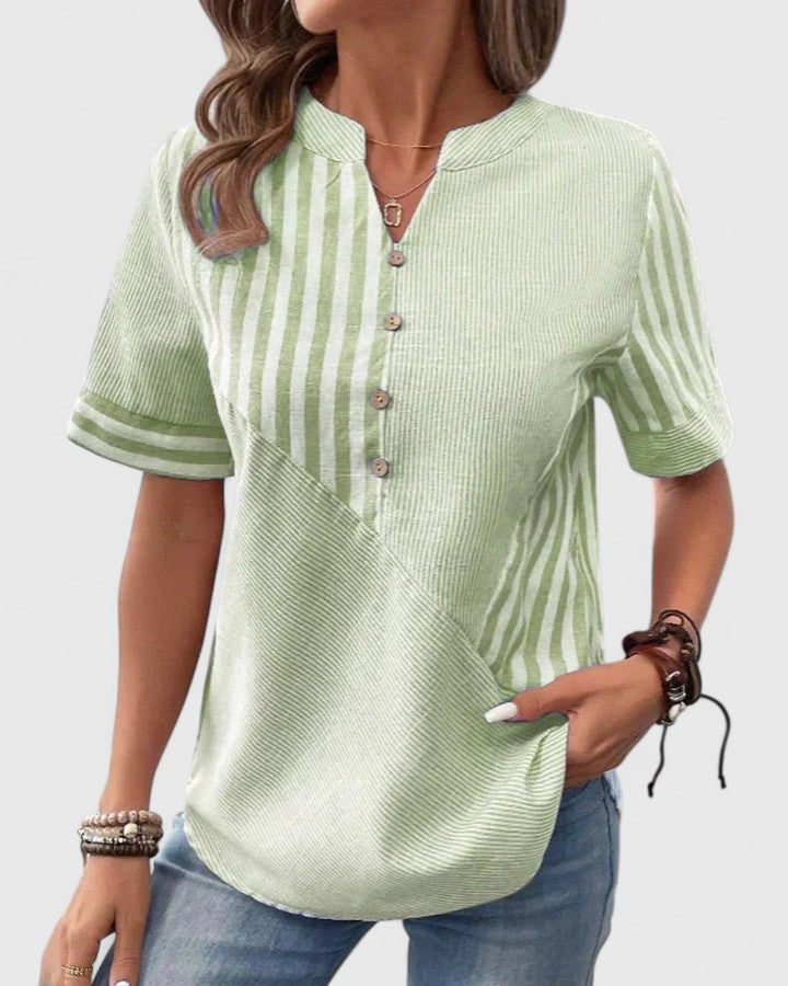 Isabel y Miguel Madrid Gigi sophisticated blouse in elegant fabric, showcased on a model with stylish detailing and a modern fit.