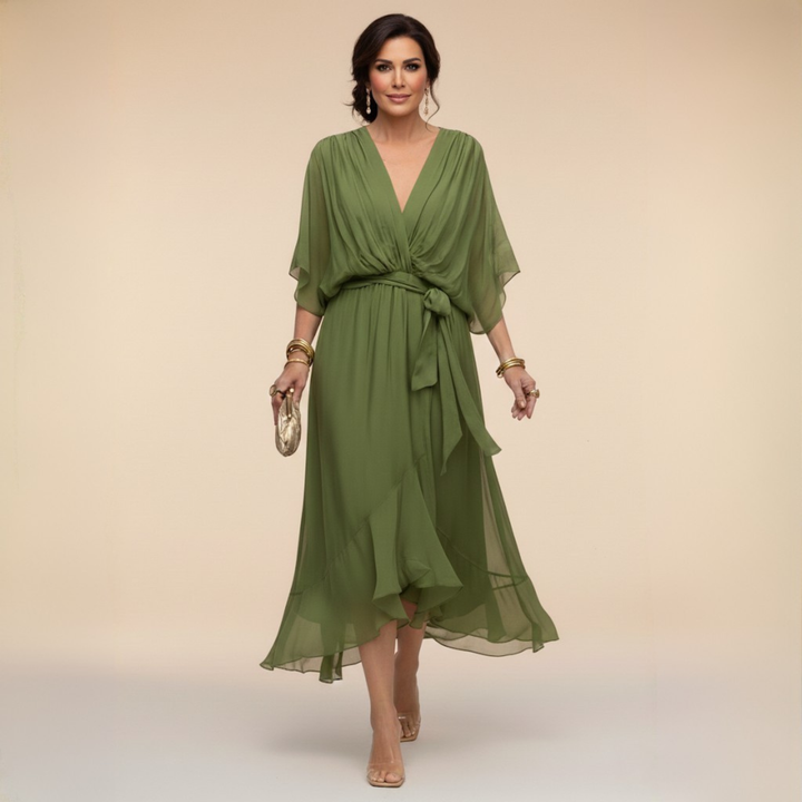 Isabel y Miguel Madrid Monica chiffon dress with V-neckline, flowing fabric, and elegant design.