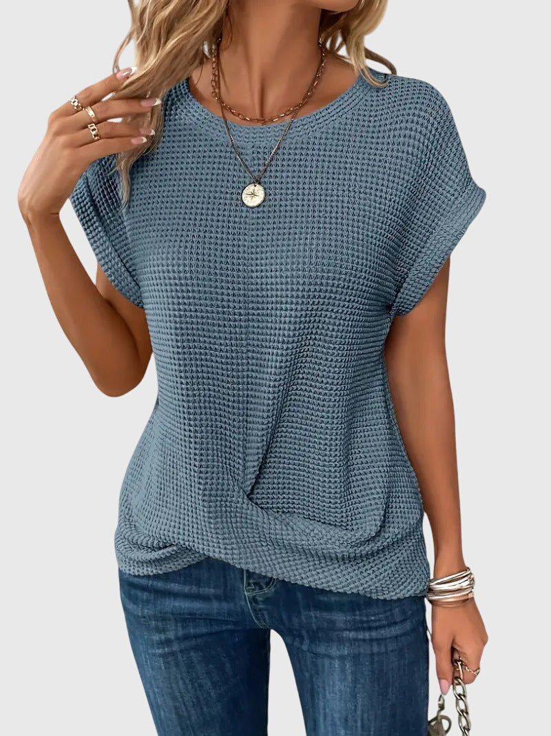 Isabel y Miguel Madrid Isa™ chic blouse with round neckline, featuring elegant fabric and stylish design on a neutral background.