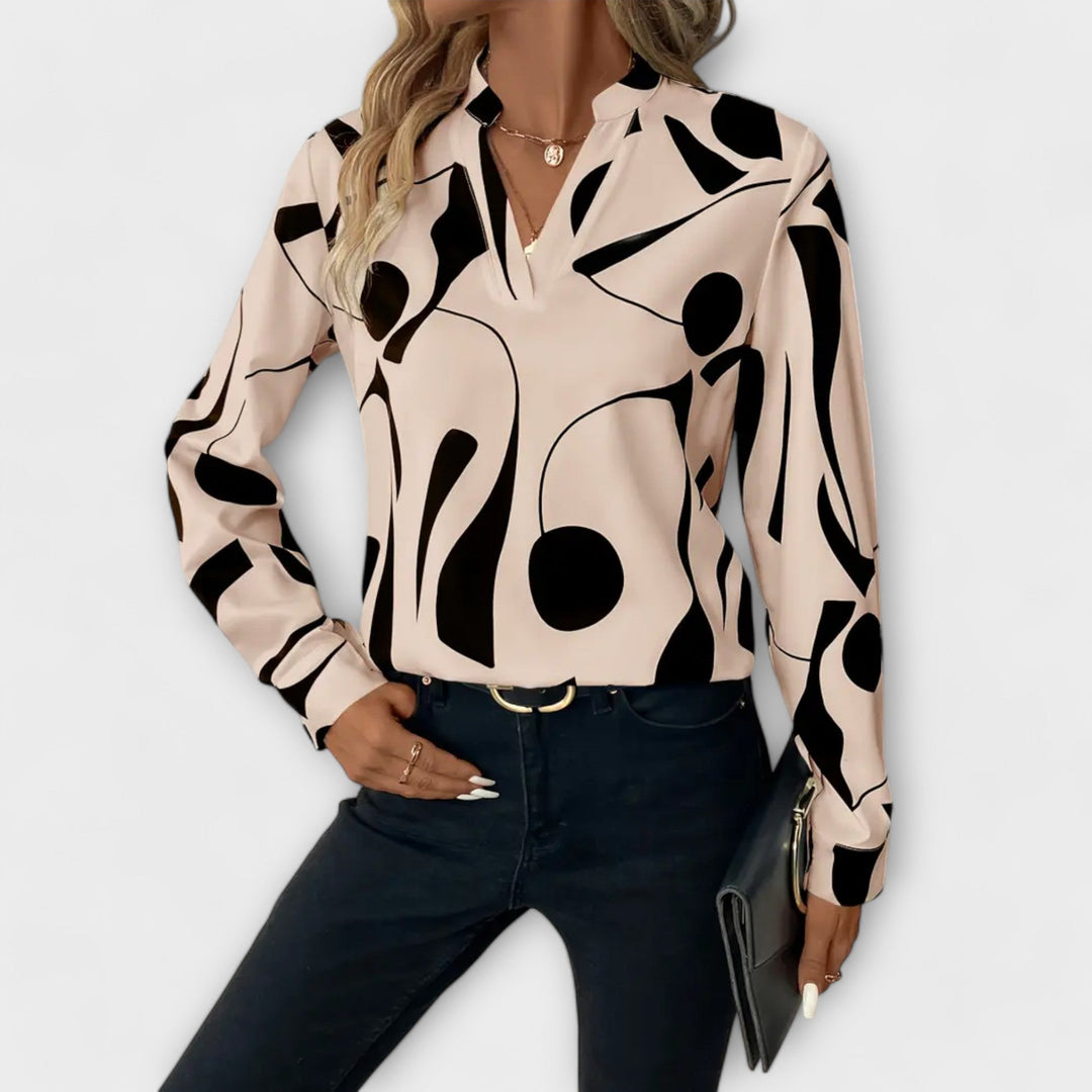 Elegant Lara™ blouse by Isabel y Miguel Madrid, featuring a stylish design and quality fabric, shown on a mannequin.