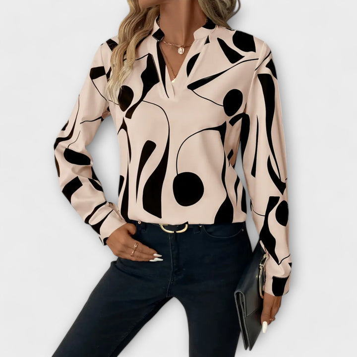 Elegant Lara™ blouse by Isabel y Miguel Madrid, featuring a stylish design and quality fabric, shown on a mannequin.