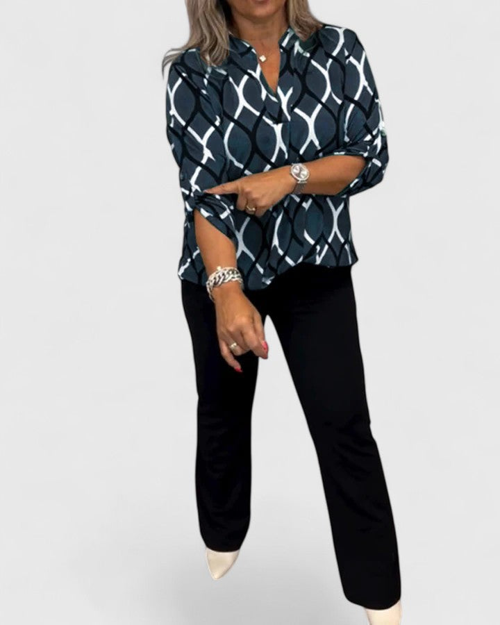 Elegant Isabel y Miguel Madrid Ella blouse in stylish black fabric, featuring a sophisticated design and feminine fit.