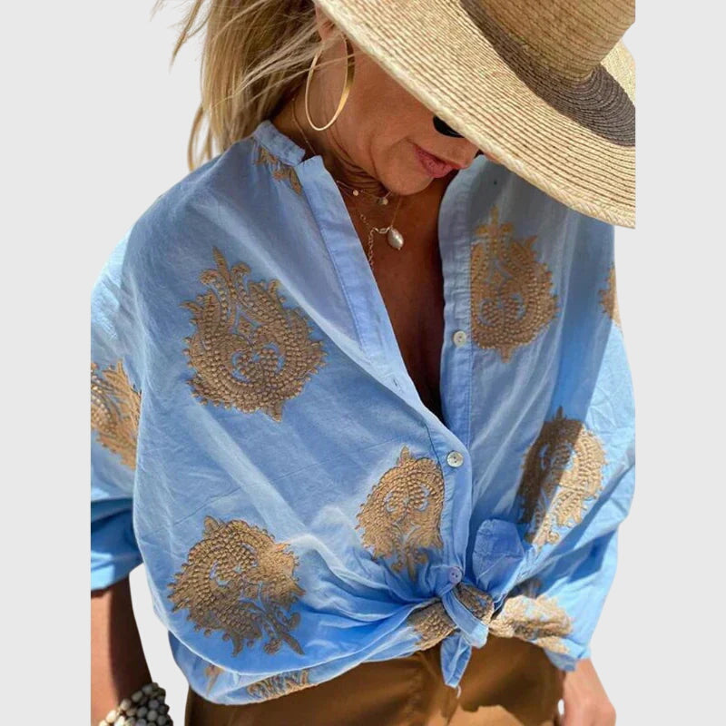 Elegant light blouse by Isabel y Miguel Madrid featuring a stylish design, perfect for sophisticated casual or formal wear.