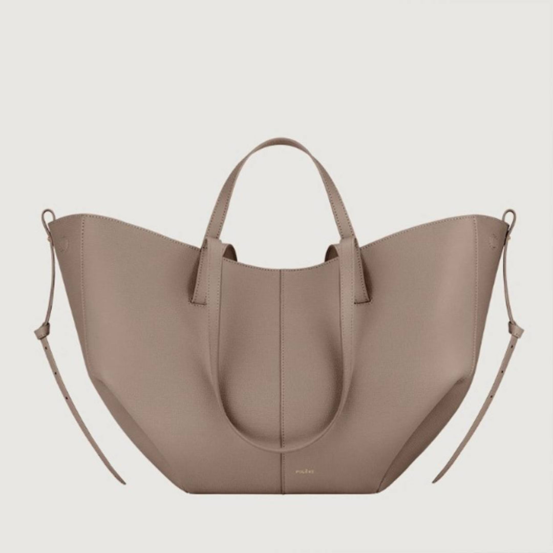 Olivia vintage tote bag by Isabel y Miguel Madrid, featuring textured leather and spacious design, shown in a close-up view.