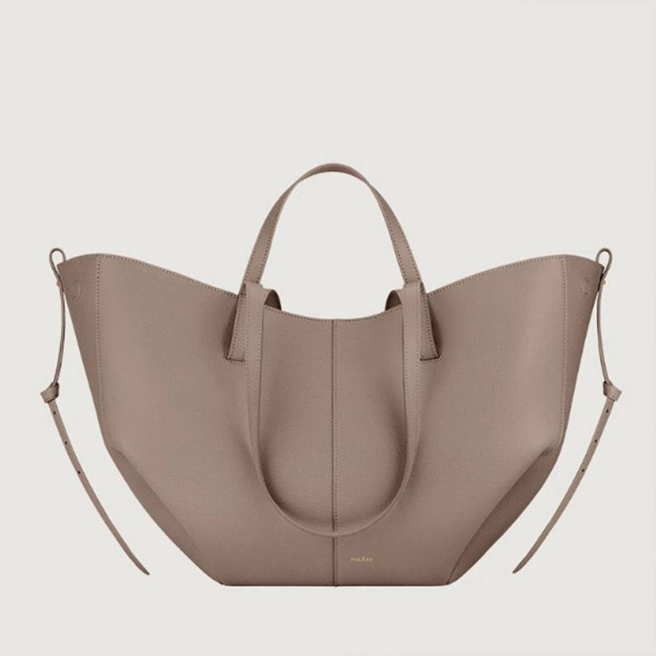 Olivia vintage tote bag by Isabel y Miguel Madrid, featuring textured leather and spacious design, shown in a close-up view.