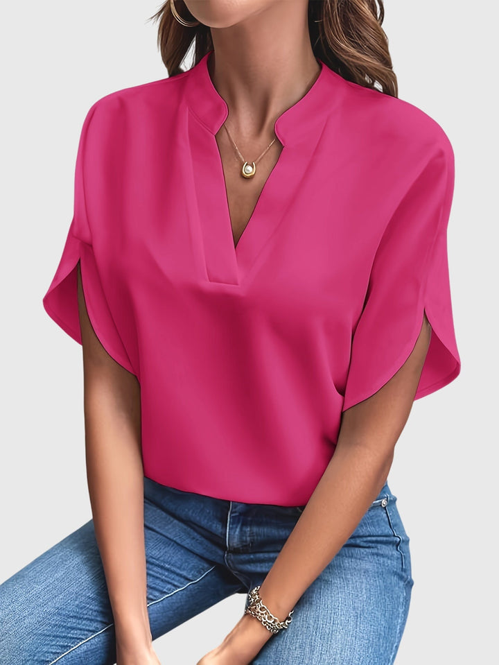 Elegant Kristie™ blouse by Isabel y Miguel Madrid, featuring stylish design and high-quality fabric, displayed on a mannequin.
