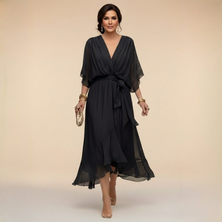 Isabel y Miguel Madrid Monica chiffon dress with V-neckline, flowing fabric, and elegant design for special occasions.