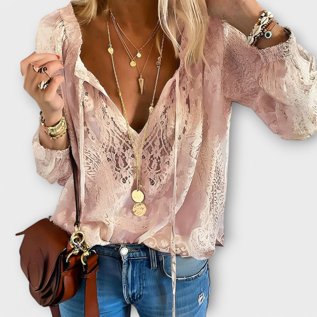 Elegant beige Brunetta blouse by Isabel y Miguel Madrid, featuring a stylish design displayed on a white background.