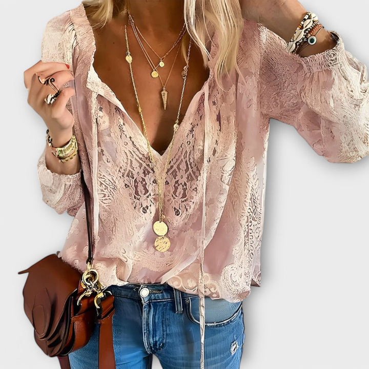 Elegant beige Brunetta blouse by Isabel y Miguel Madrid, featuring a stylish design displayed on a white background.