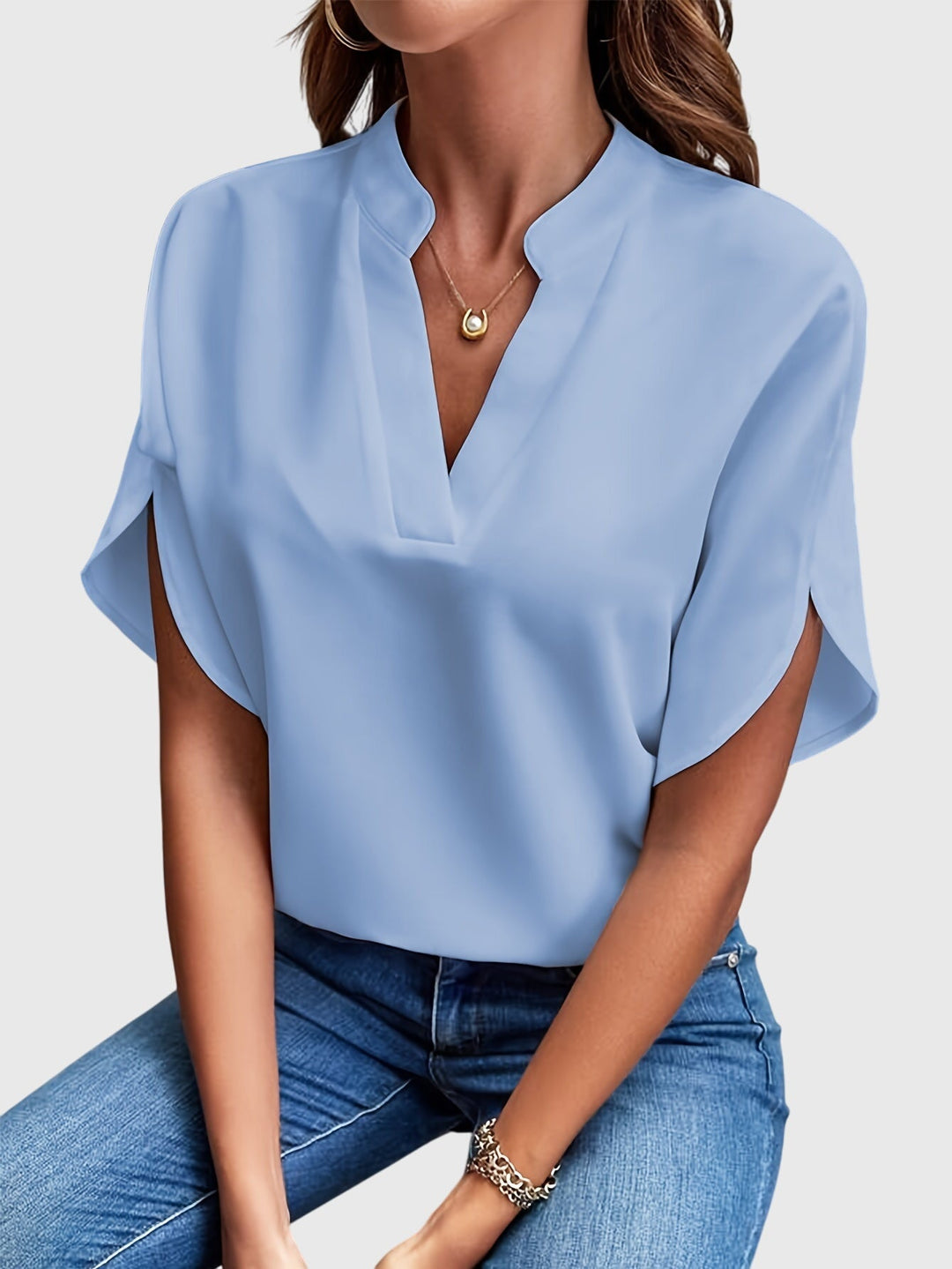 Elegant Kristie™ blouse by Isabel y Miguel Madrid, featuring a stylish design in soft fabric, showcased on a neutral background.