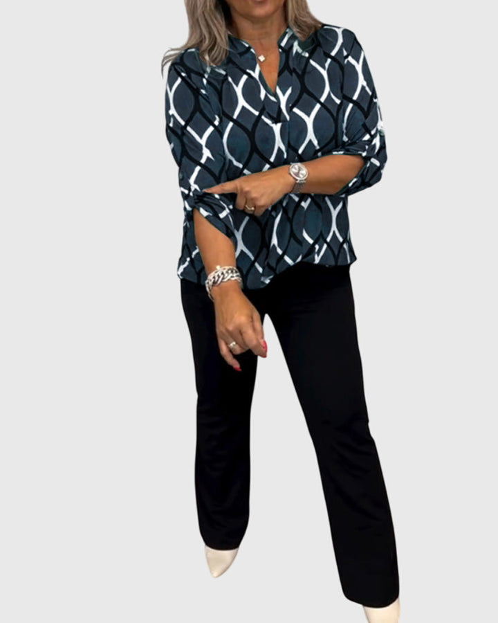Isabel y Miguel Madrid Janny™ top informal casual blouse with short sleeves and relaxed fit, displayed on a hanger.