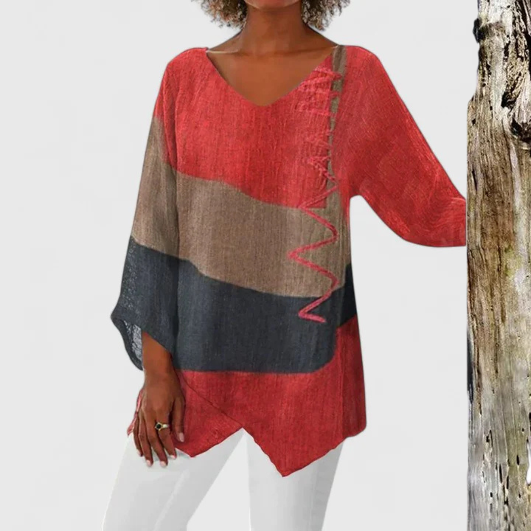 Elysia viscose tunic blouse by Isabel y Miguel Madrid, featuring a sophisticated design in soft fabric, displayed on a hanger.