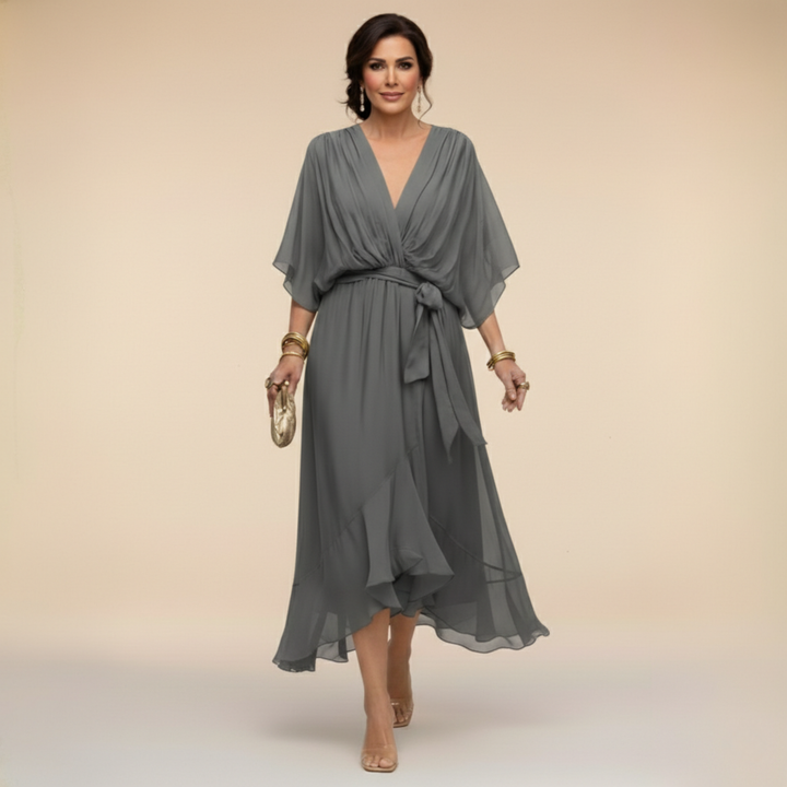 Isabel y Miguel Madrid Monica chiffon dress with V-neckline, flowing fabric, and elegant design for special occasions.