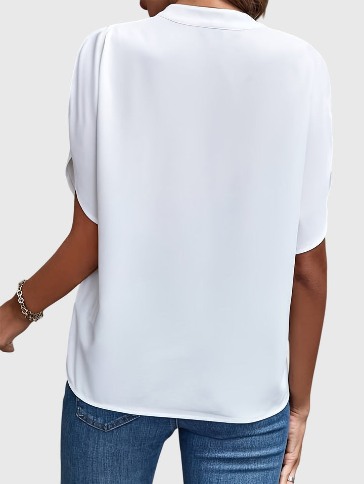 Elegant Kristie™ blouse by Isabel y Miguel Madrid featuring a stylish design and intricate details, perfect for sophisticated outfits.