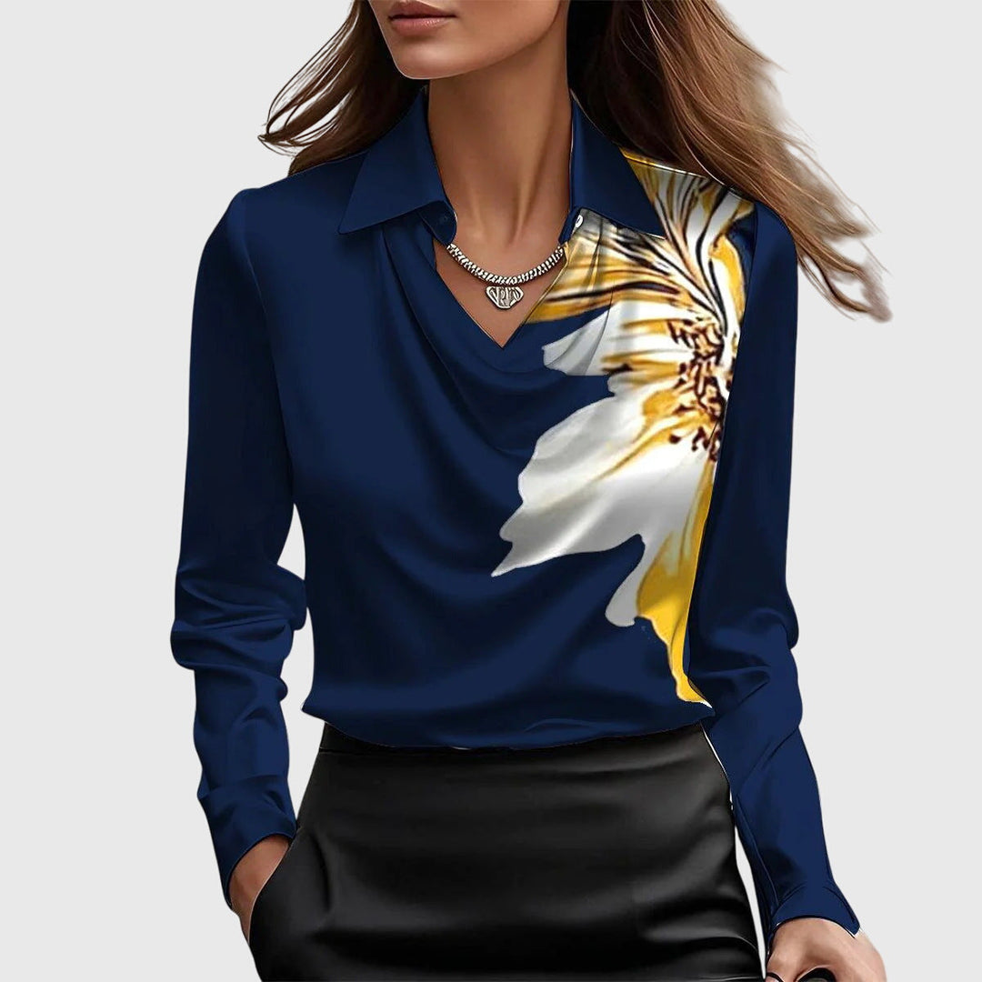 Elegant Brooklyn™ blouse by Isabel y Miguel Madrid, featuring stylish fabric and a flattering fit, displayed on a hanger.