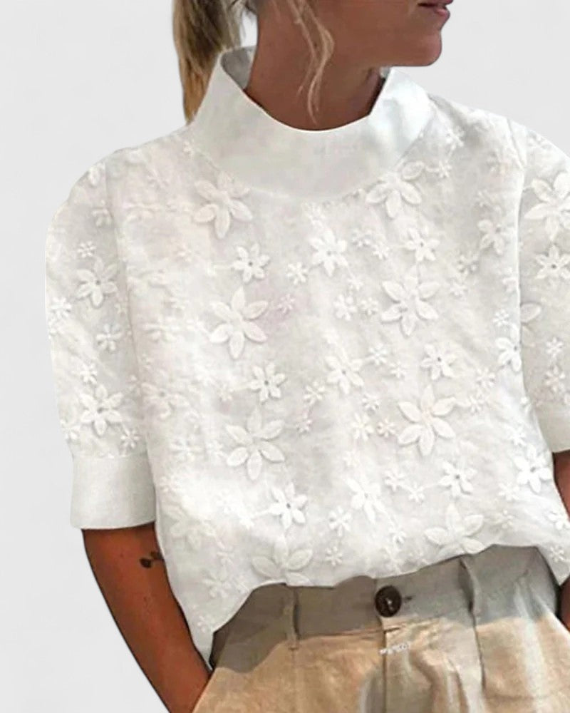 Sonelita™ elegant high-neck blouse by Isabel y Miguel Madrid, featuring a stylish design and soft fabric.
