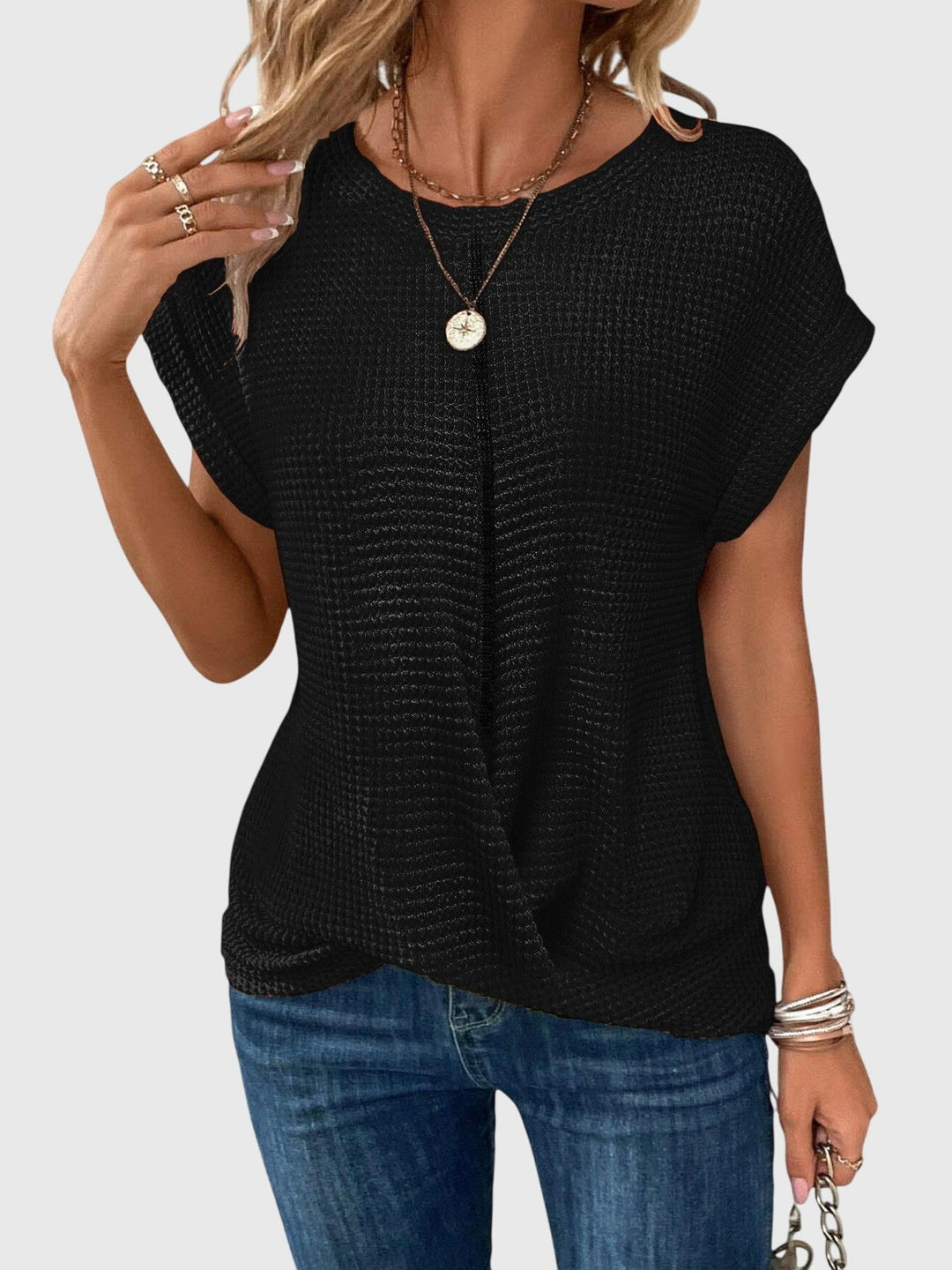 Isabel y Miguel Madrid Isa™ chic blouse with round neckline, soft fabric, and stylish design, displayed on a mannequin.