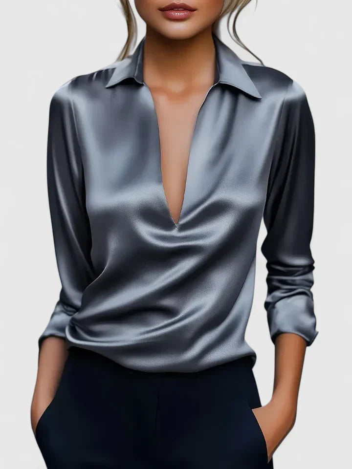 Elegant Isabel y Miguel Madrid Calvina blouse in sophisticated fabric, featuring a stylish design, displayed on a neutral background.