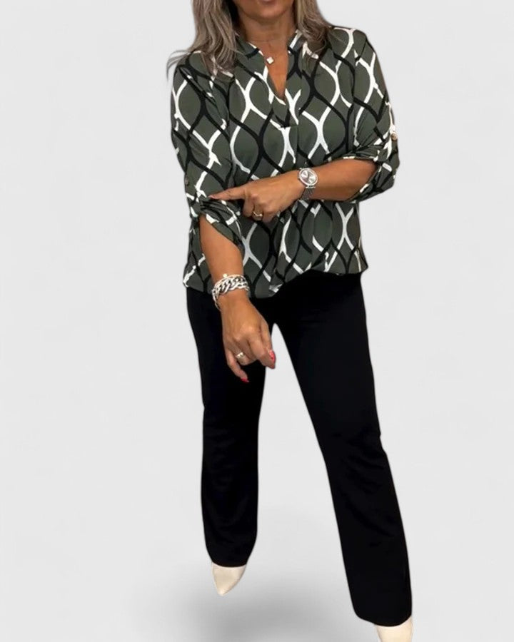Elegant Isabel y Miguel Madrid Ella blouse with stylish design and sophisticated fit, shown in a close-up image.