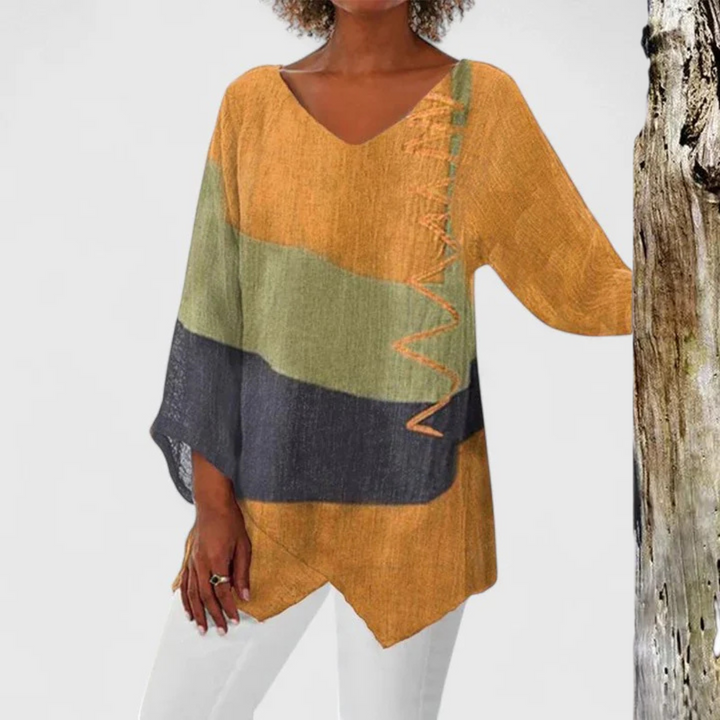 Elysia viscose tunic blouse by Isabel y Miguel Madrid, featuring a sophisticated design with flowing fabric and elegant details.
