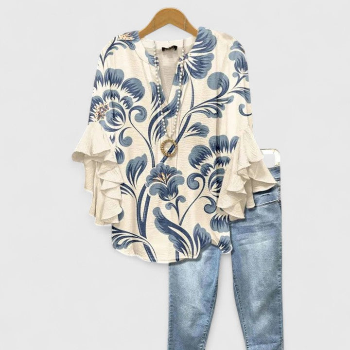 Elegant Isabel y Miguel Madrid Taylisse blouse with a sleek, stylish design, displayed on a neutral background.