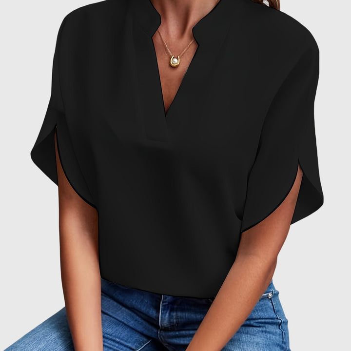 Elegant Kristie™ blouse by Isabel y Miguel Madrid, featuring stylish fabric and a sophisticated design for fashionable wear.