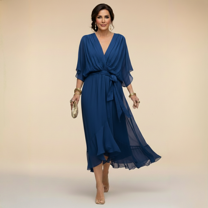 Isabel y Miguel Madrid Monica chiffon V-neck dress showcased in this image with flowing fabric and elegant design.