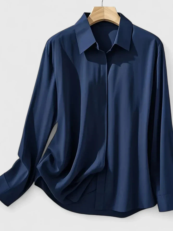 Elegant Melvaya top by Isabel y Miguel Madrid, showcasing a stylish, sophisticated design in a close-up view.