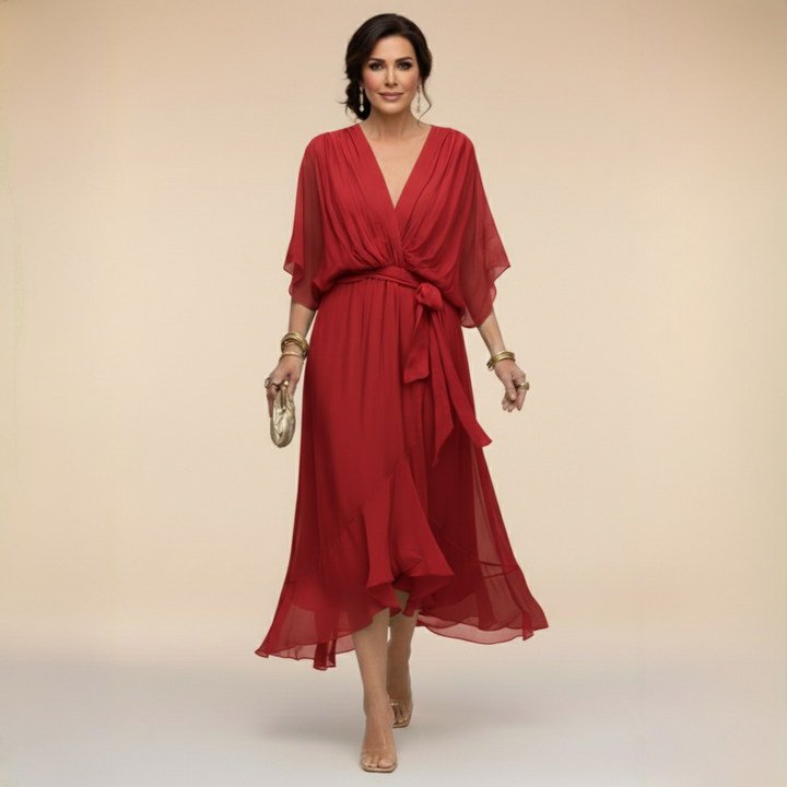 Isabel y Miguel Madrid Monica chiffon dress with V-neckline, flowing fabric, and elegant design suitable for special occasions.