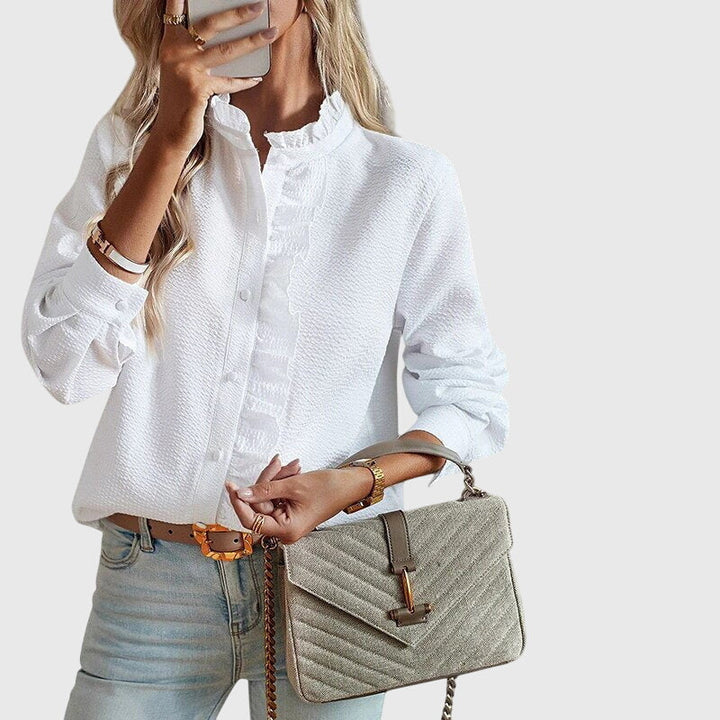 Elegant Kaitlyn™ blouse by Isabel y Miguel Madrid, featuring a stylish design and lightweight fabric, perfect for sophisticated looks.