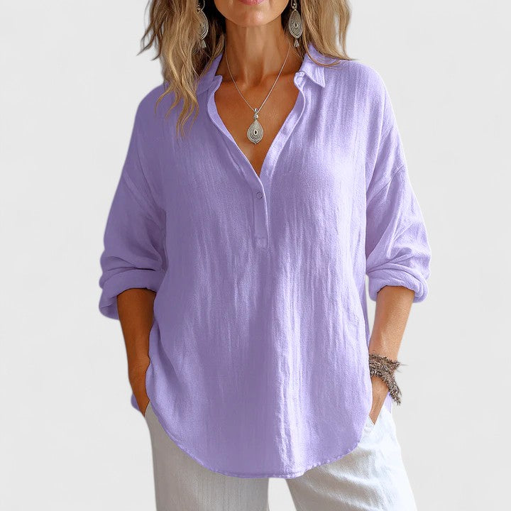 Franzina Isabel y Miguel Madrid linen blouse with relaxed fit, featuring a V-neck and short sleeves, in a neutral color.
