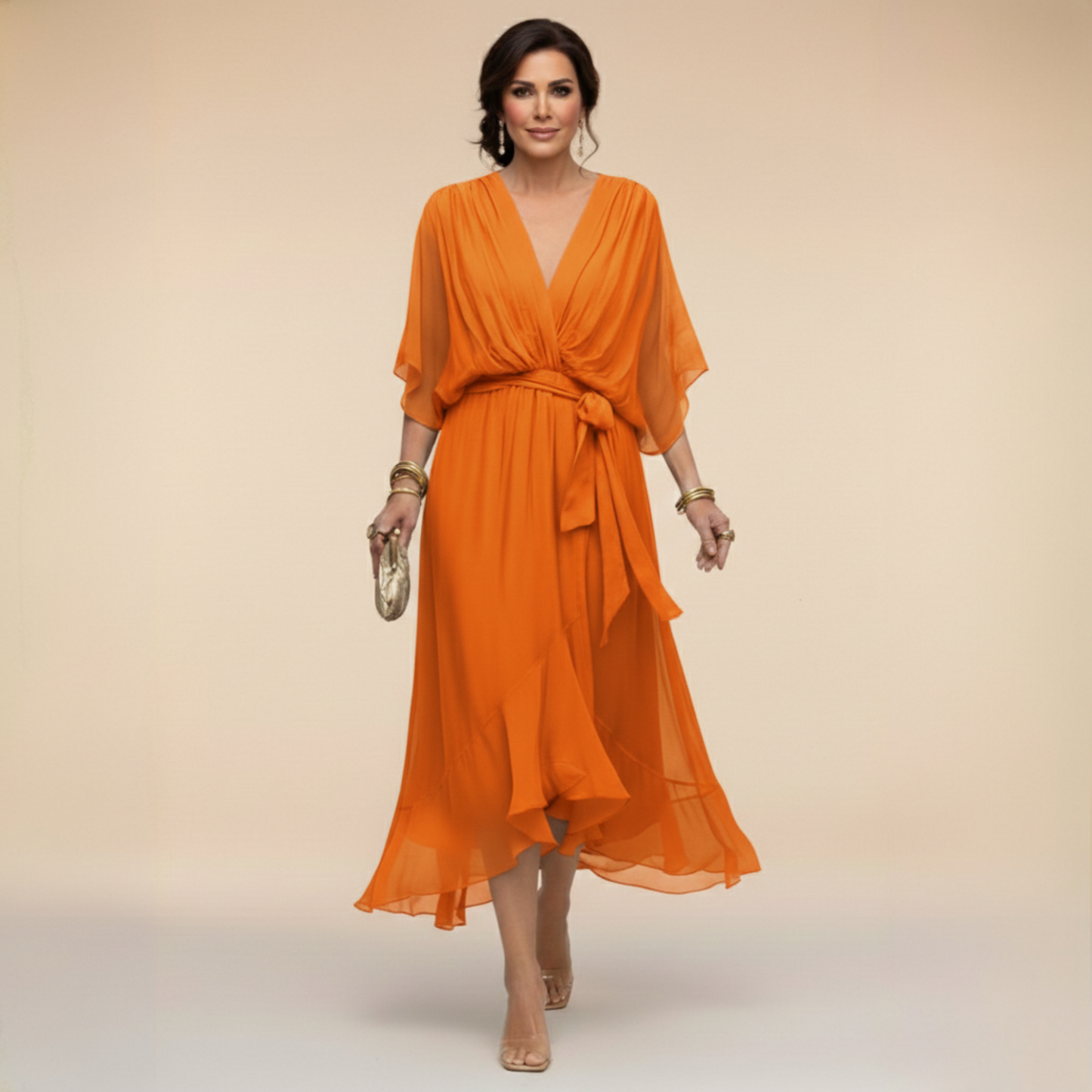 Isabel y Miguel Madrid Monica chiffon dress with V-neck, flowing fabric and elegant design, shown in a stylish fashion photo.