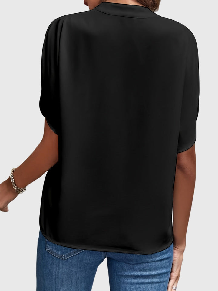 Elegant Kristie™ blouse by Isabel y Miguel Madrid, featuring a stylish design with soft fabric and a flattering fit.