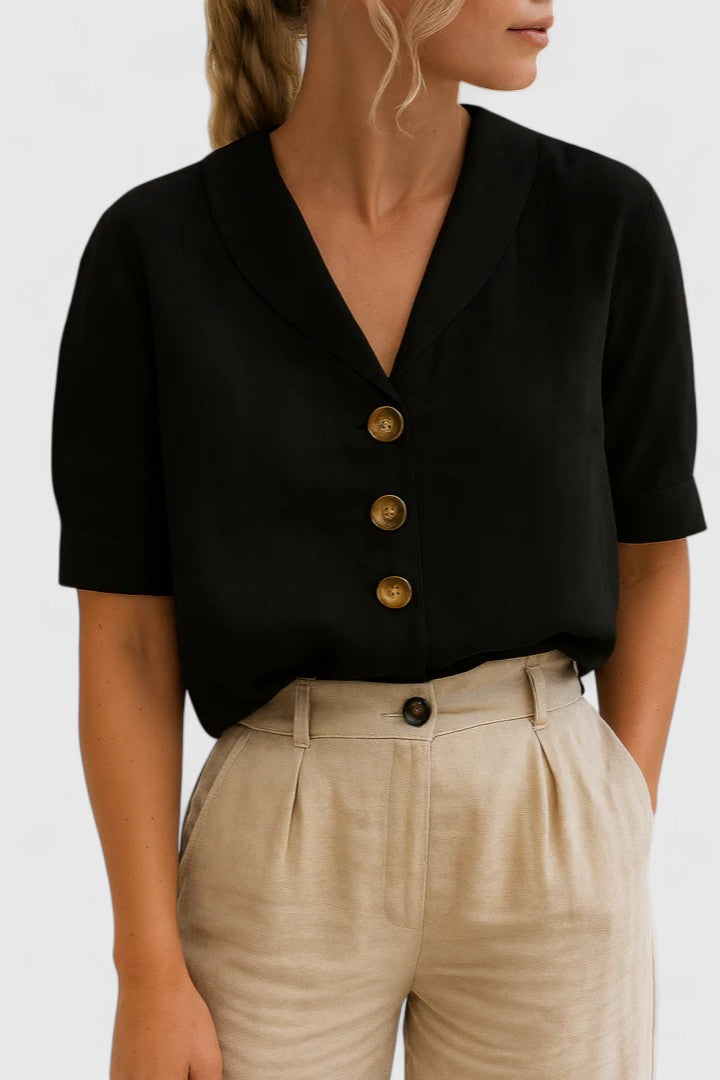 Elegant Isabel y Miguel Madrid Charlie blouse featuring a stylish design, displayed on a mannequin in a well-lit setting.