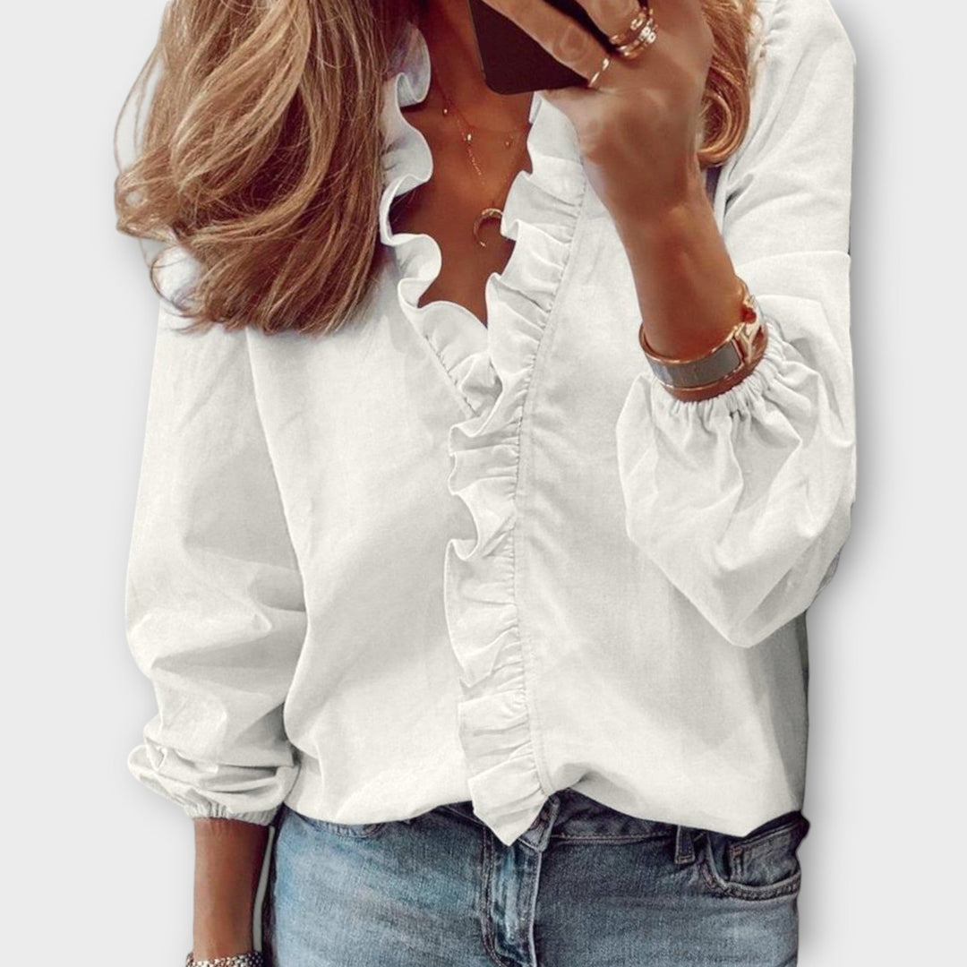 Isadora summer blouse by Isabel y Miguel Madrid, featuring lightweight fabric and elegant design, worn by a model.