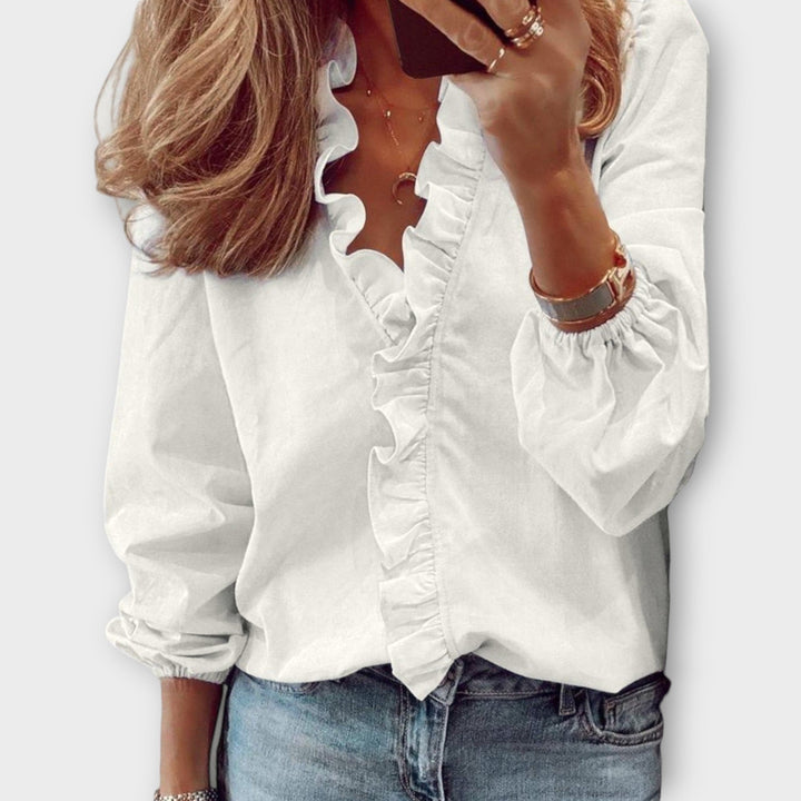 Isadora summer blouse by Isabel y Miguel Madrid, featuring lightweight fabric and elegant design, worn by a model.