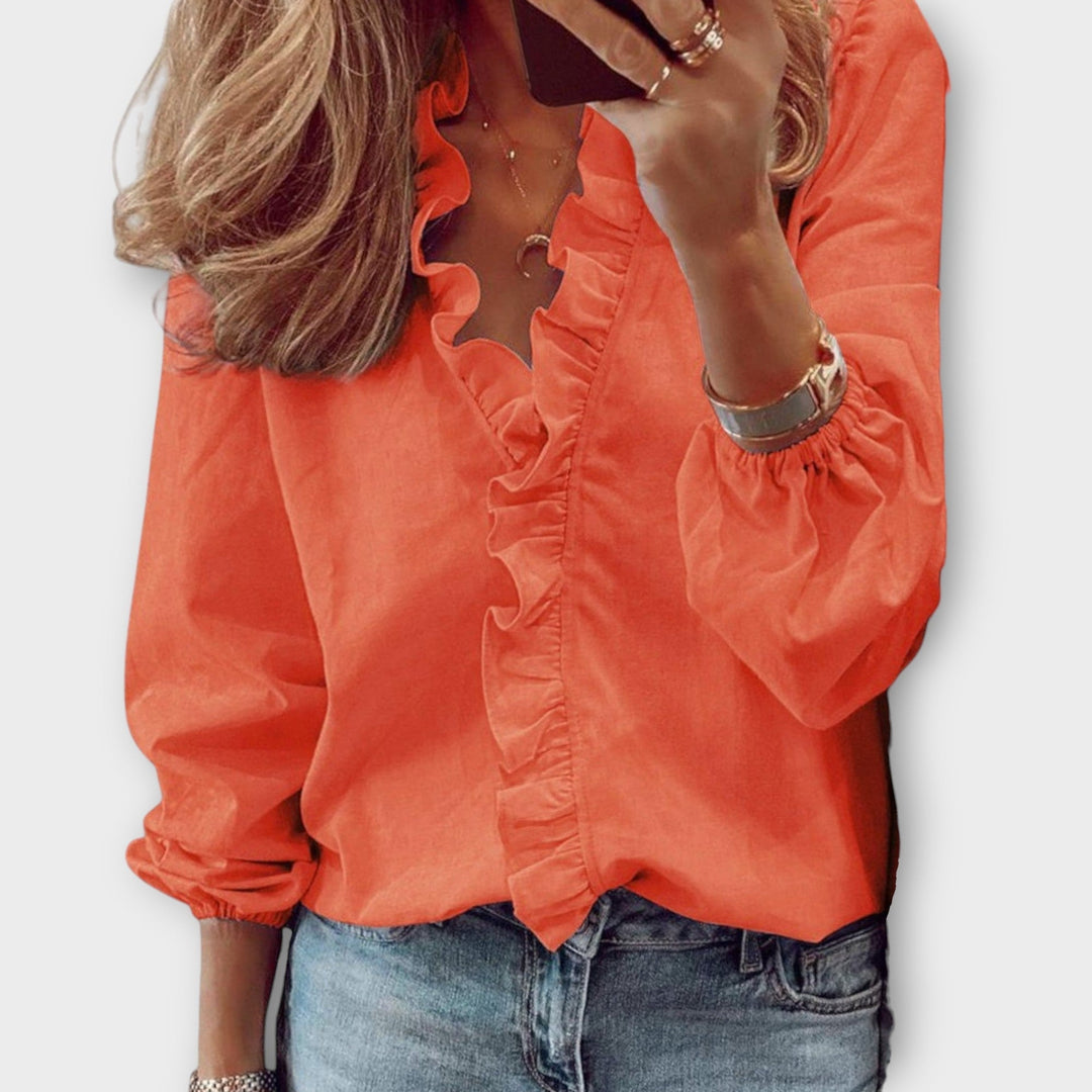 Isadora summer blouse by Isabel y Miguel Madrid, featuring lightweight fabric and elegant design, shown on a model.