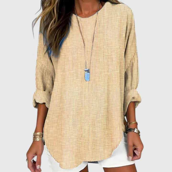 Light beige Cressida comfortable blouse by Isabel y Miguel Madrid, shown on a model with relaxed fit and soft fabric details.