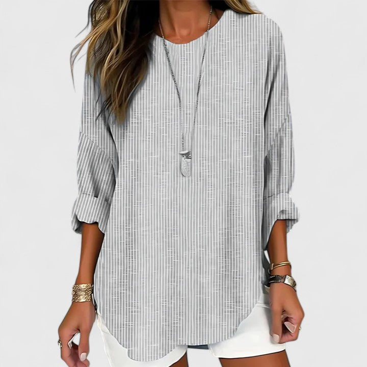 Comfortable Isabel y Miguel Madrid Cressida blouse in soft fabric, shown on a hanger with a relaxed fit and subtle detailing.