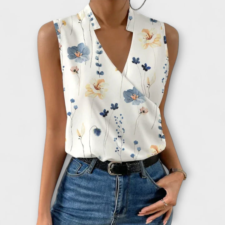 Isabel y Miguel Madrid Loretta women’s sleeveless V-neck top with print, casual summer blouse in white.