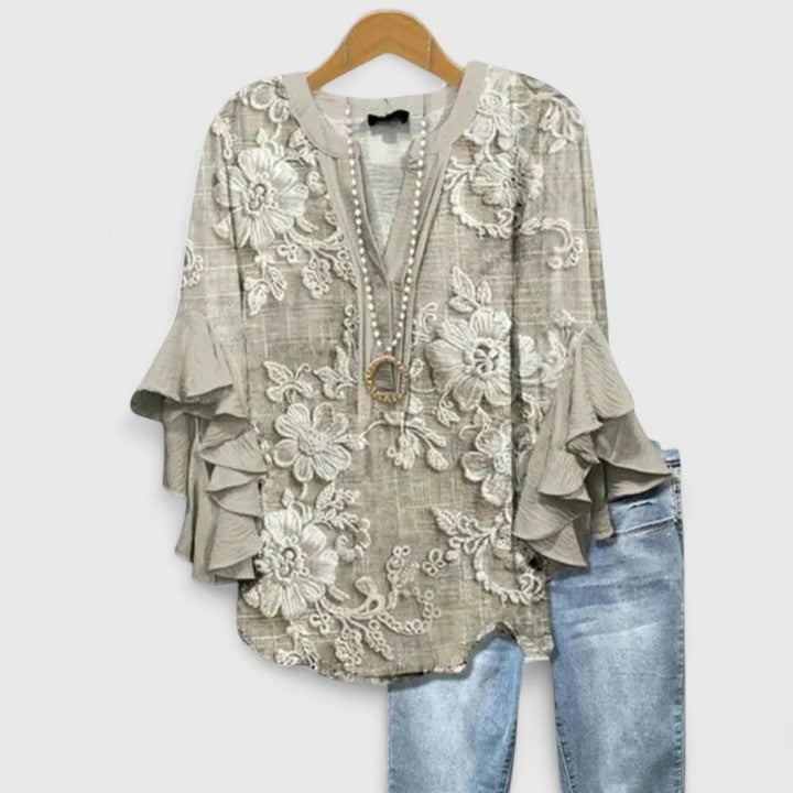 Elegant Isabel y Miguel Madrid blusa by Taylisse featuring a stylish, fitted design with intricate details and a sophisticated look.