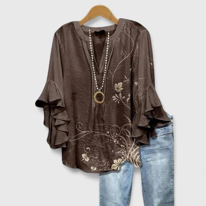 Elegant Isabel y Miguel Madrid Blusa by Taylisse with stylish design, featuring flowing fabric and sophisticated details.