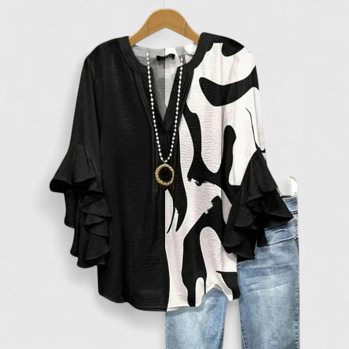 Isabel y Miguel Madrid Saryphiah comfortable blouse in soft fabric, shown in a relaxed fit with long sleeves and subtle design details.