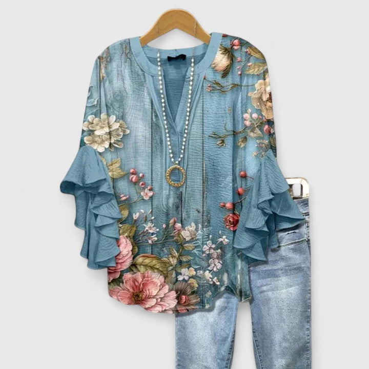 Elegant Isabel y Miguel Madrid Taylisse blouse featuring a stylish design and comfortable fit, showcased on a neutral background.